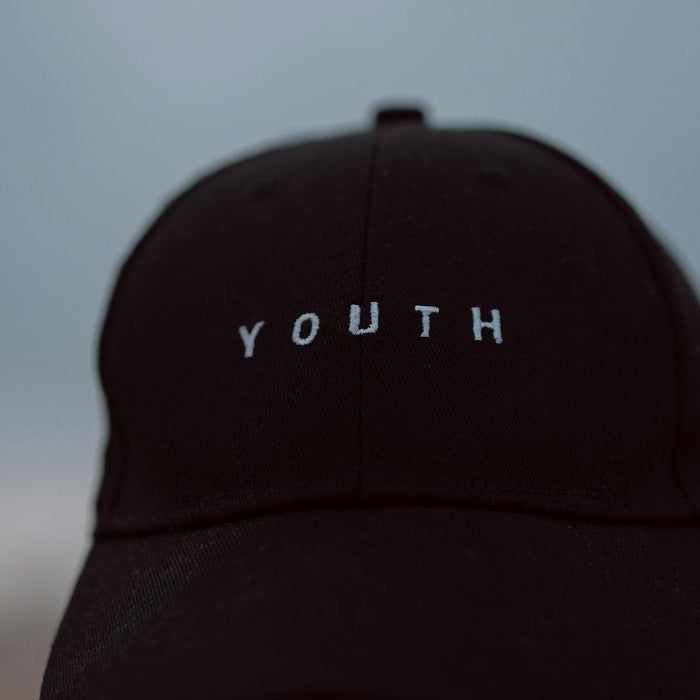 Close-up view of a black cap with 'Youth' text in Casablanca, Morocco.