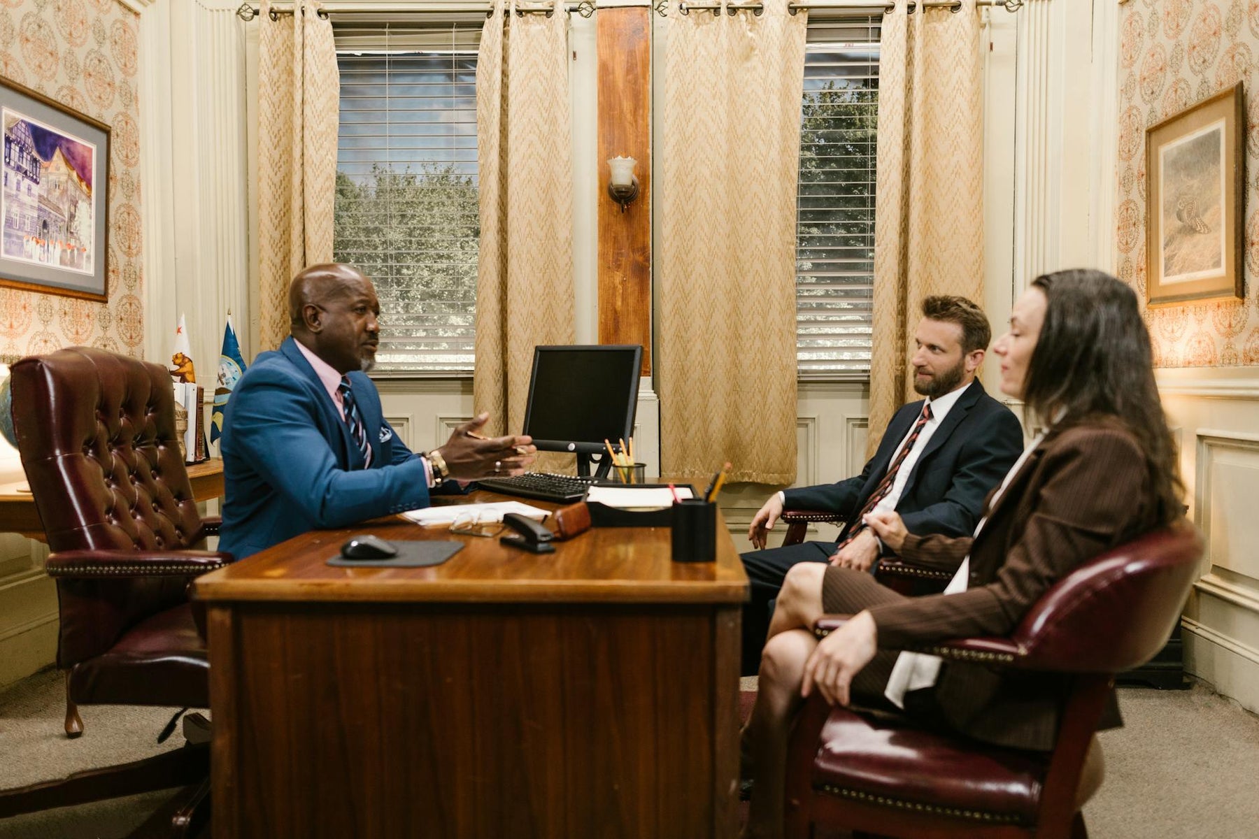 Lawyers discussing with a client in a professional office environment. Business meeting concept.