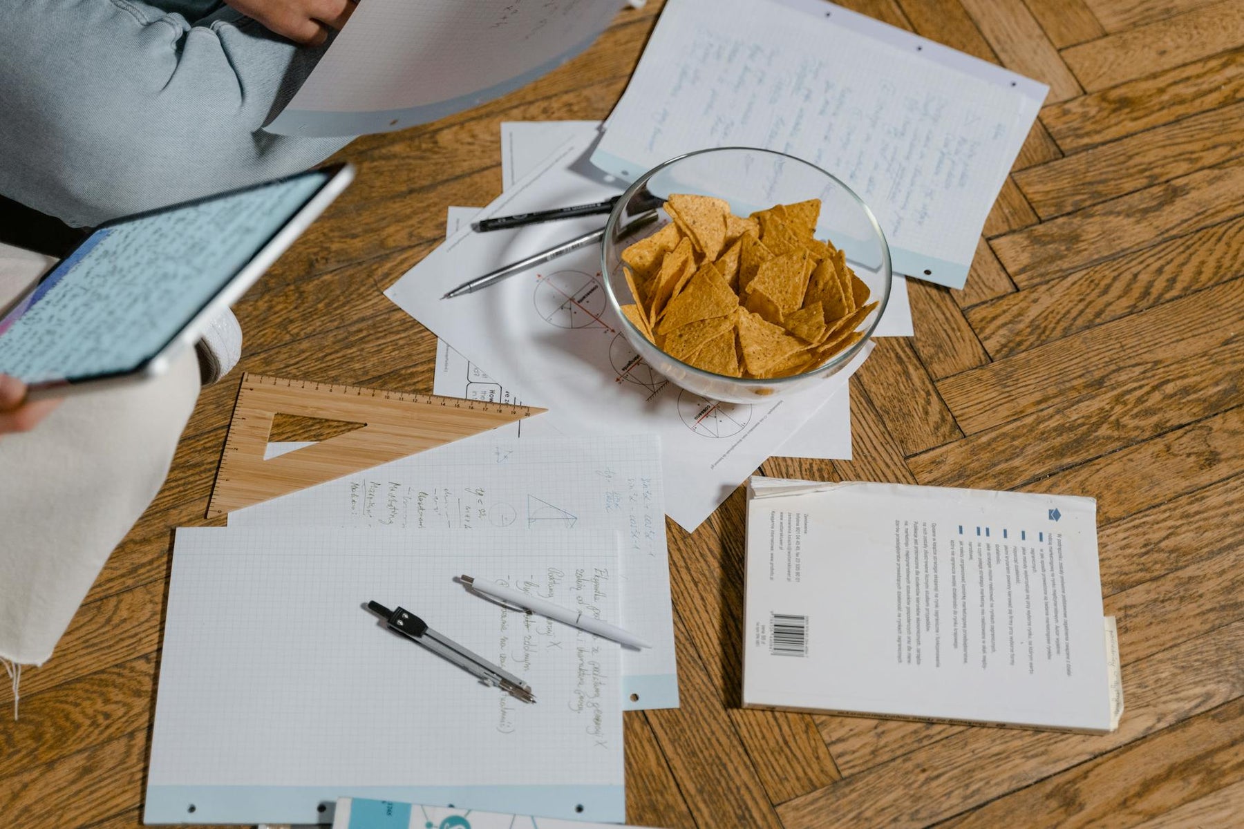 A cozy study session with notes, snacks, and digital devices, perfect for elearning.