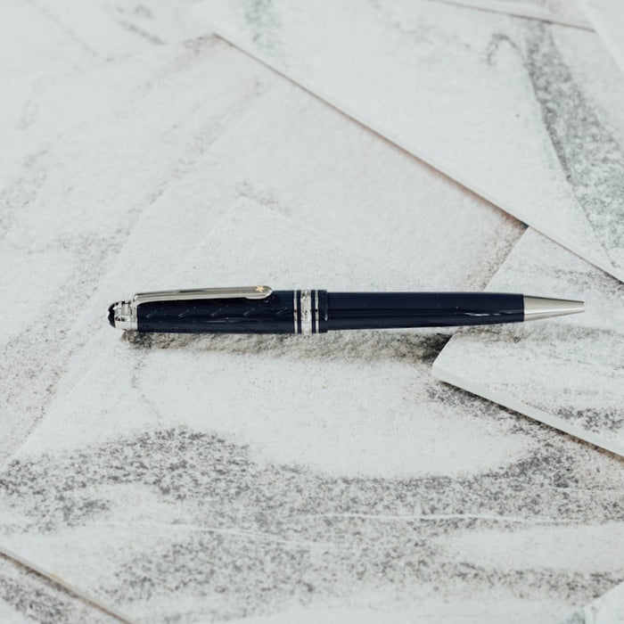 black twist pen on white paper