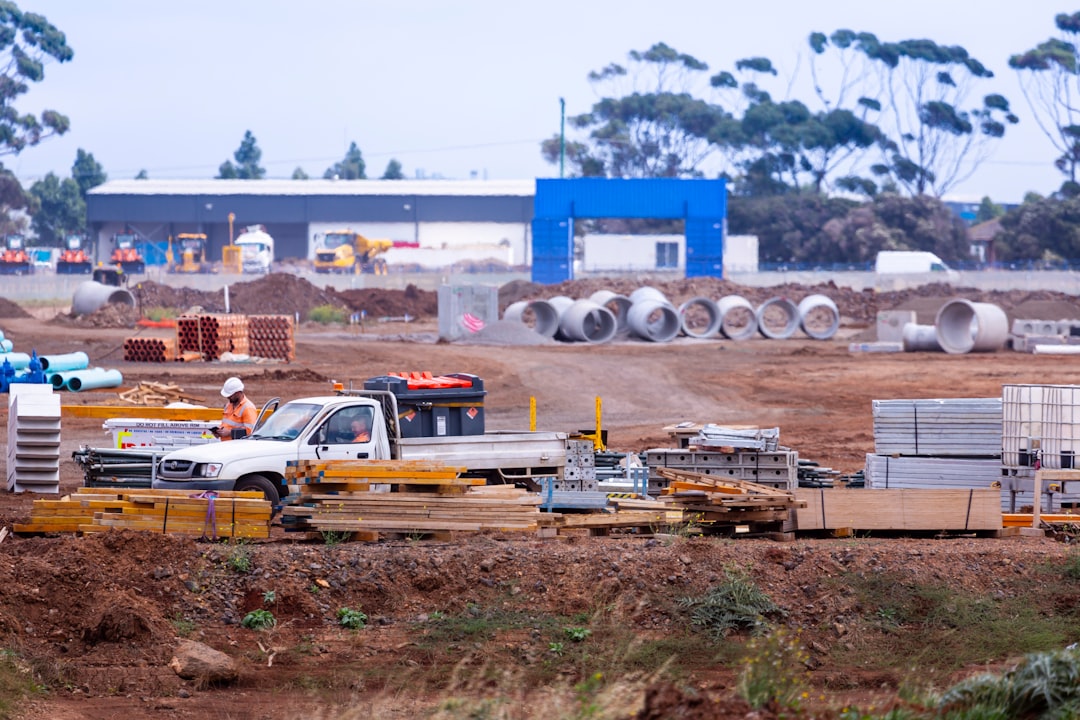 yellow and white sedan on brown field during daytime