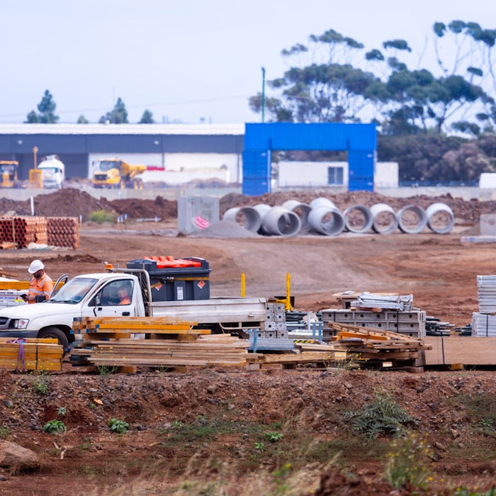 yellow and white sedan on brown field during daytime