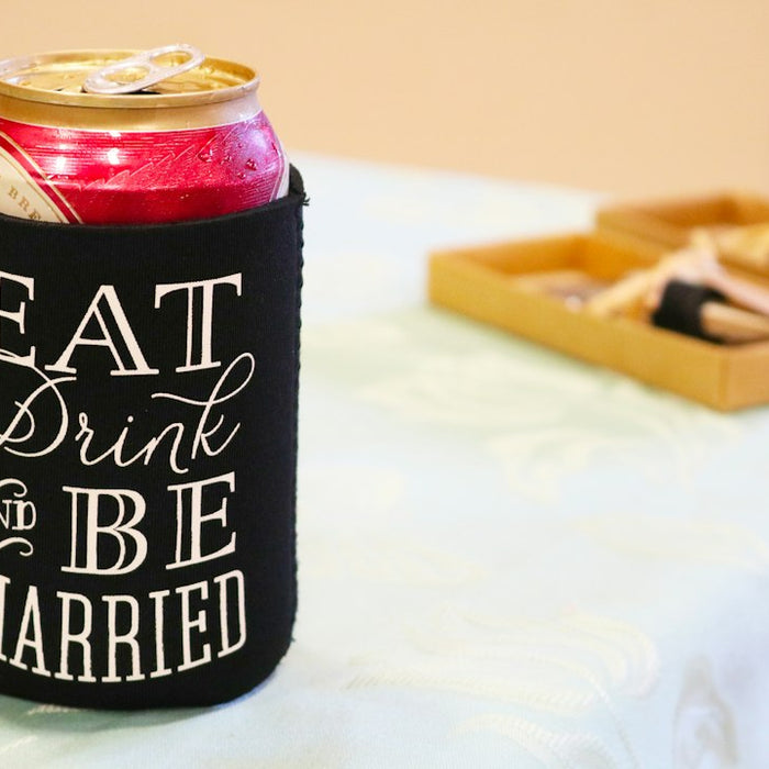 black and red can on white table