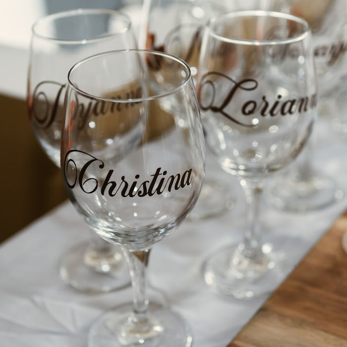 clear wine glass on white ceramic plate