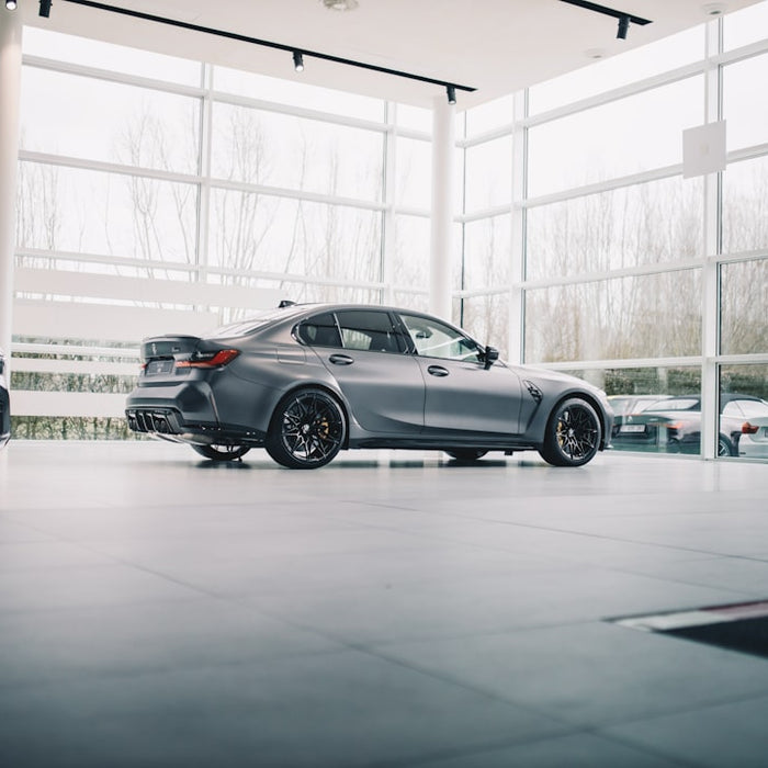 black coupe parked in a building