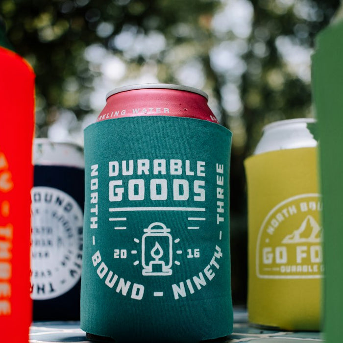 a group of can coolers sitting on top of a table