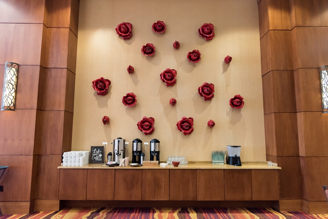 a wall with roses on it in a room