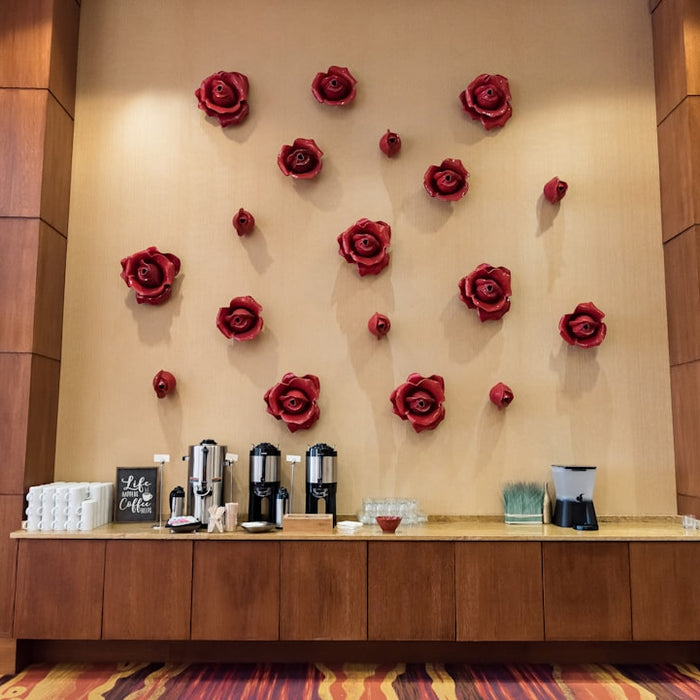 a wall with roses on it in a room