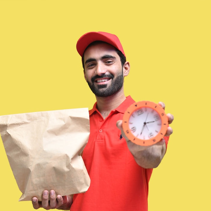 a person holding a clock