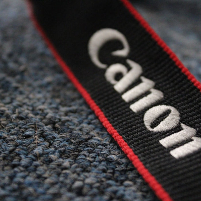 a close-up of a red and white sign