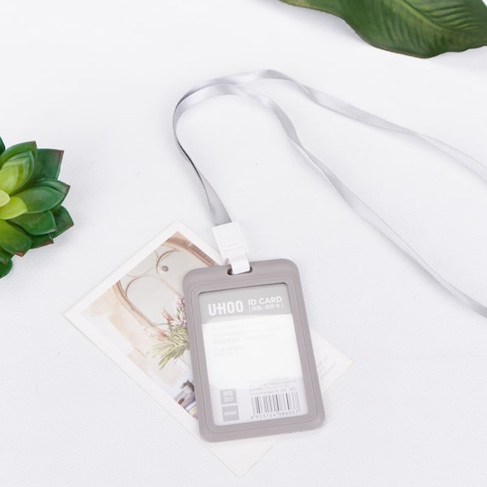 a white table topped with a green plant and a tag