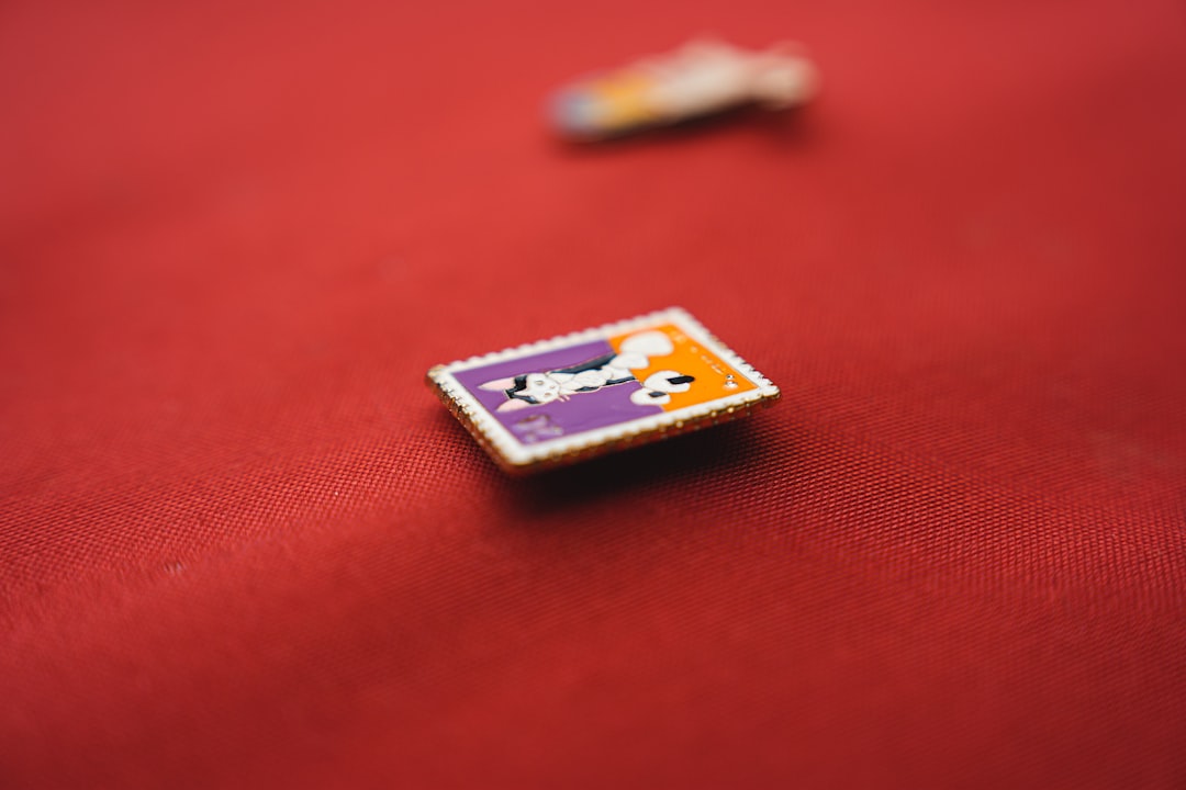 a close up of a button on a red cloth