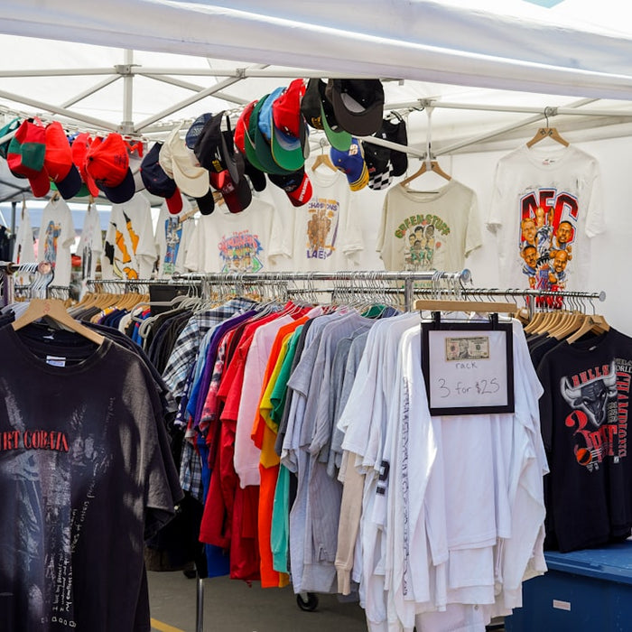 a tent that has a bunch of shirts on it