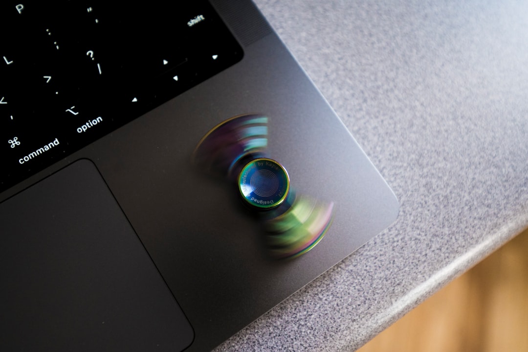 a blurry picture of a cd on top of a laptop