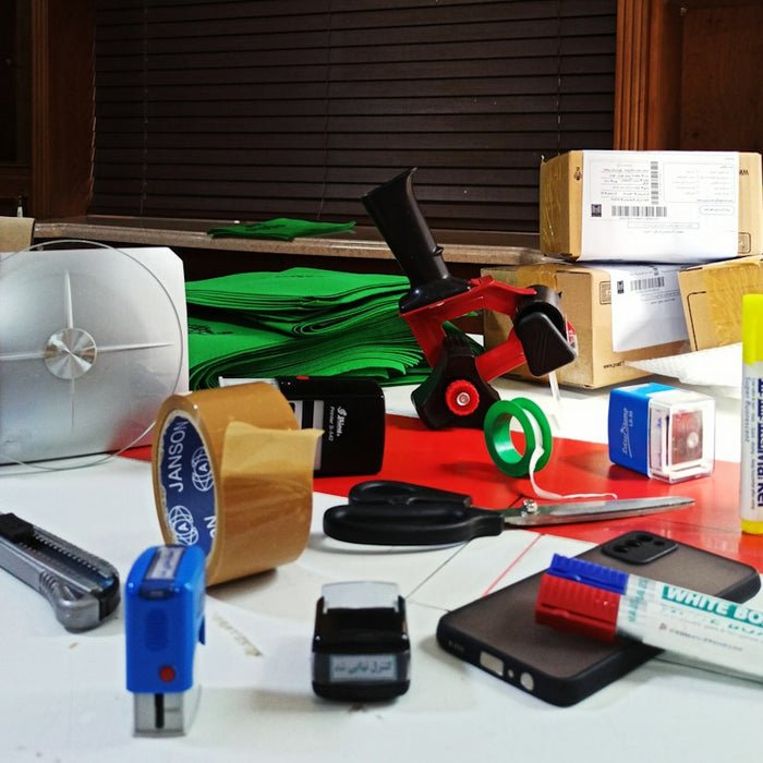 a table topped with lots of different types of electronics