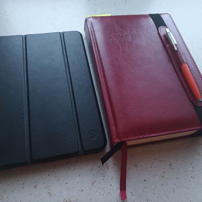 two notebooks sitting next to each other on a table