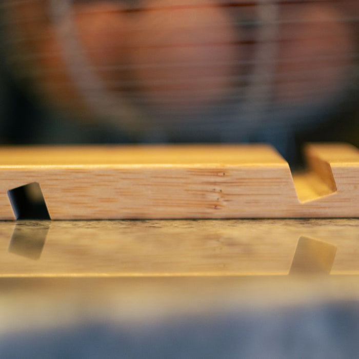 a close up of a wooden object on a table