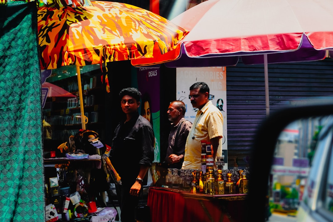Men standing at a street market stall