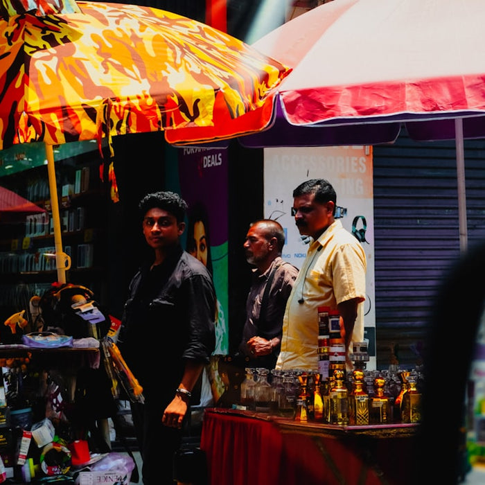 Men standing at a street market stall