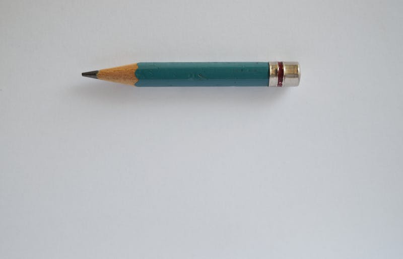 A single pencil on empty white background - minimum order quantity humour