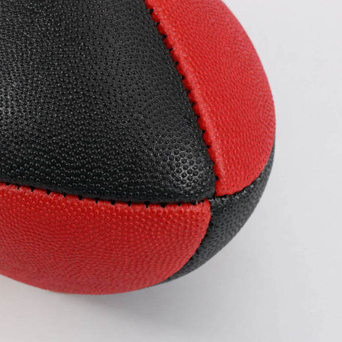 Mini Aussie Rules Ball - A Mini Aussie Rules ball in red and black, featuring a textured surface and seam detailing.