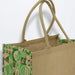 Torino Jute Tote Bag - A jute tote bag in natural brown with a vibrant green patterned design and two sturdy handles.