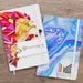 Supra Full Colour Notebook - Two notebooks displayed side by side, one with a colourful lion design and the other in blue marbled pattern, both featuring logos.