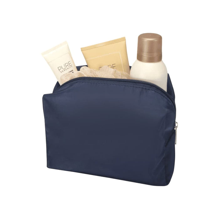 Muse GRS RPET Toiletry Bag - A navy toiletry bag containing various skincare products, including tubes and a bottle, with a textured item inside.