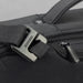 Bobby Bizz Anti-theft Backpack  Briefcase - A close-up of a black anti-theft backpack featuring a sturdy buckle and zipper detail. It has a sleek, modern design.