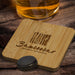 Bamboo Bottle Opener Coaster - Square - A drink bottle opener coaster made of bamboo, featuring a logo, placed on a wooden surface near a beverage.