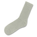 June Crew Socks - A pair of light green crew socks with a ribbed design and a smooth finish. Features a logo.