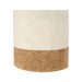 Toma Bread Basket - A Toma Bread Basket featuring a natural fabric top with a cork bottom in beige and light brown shades. It has a logo.