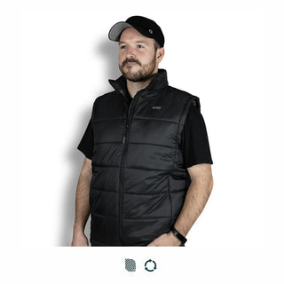 Swiss Peak Urban Puffer Vest - A man wearing a black puffer vest, featuring a zip closure and high collar, with a logo on the chest.