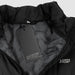 Swiss Peak Urban Puffer Vest - A black puffer vest with a high collar, featuring a tag and a subtle logo inside.