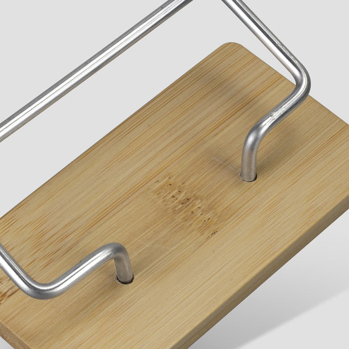 Bamboo Business Card Stand - A bamboo business card stand with a metal frame featuring a clean, natural finish. The base is made of light-coloured bamboo.