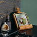 Keepsake Recipe Book Holder - A wooden recipe book holder displaying a tablet with a vibrant salad image. Features a logo on the base.