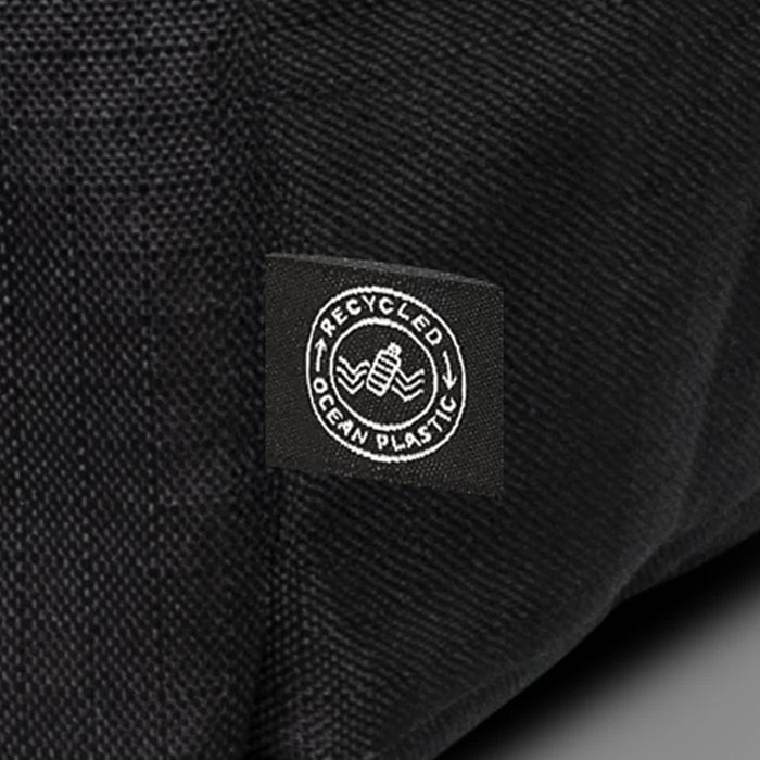Oceana Recycled Backpack - A black backpack made from recycled ocean plastic with a small logo patch.