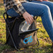 Vermont Cooler Seat - A black cooler seat with a person holding a drink bottle, featuring a transparent front pocket and a logo.