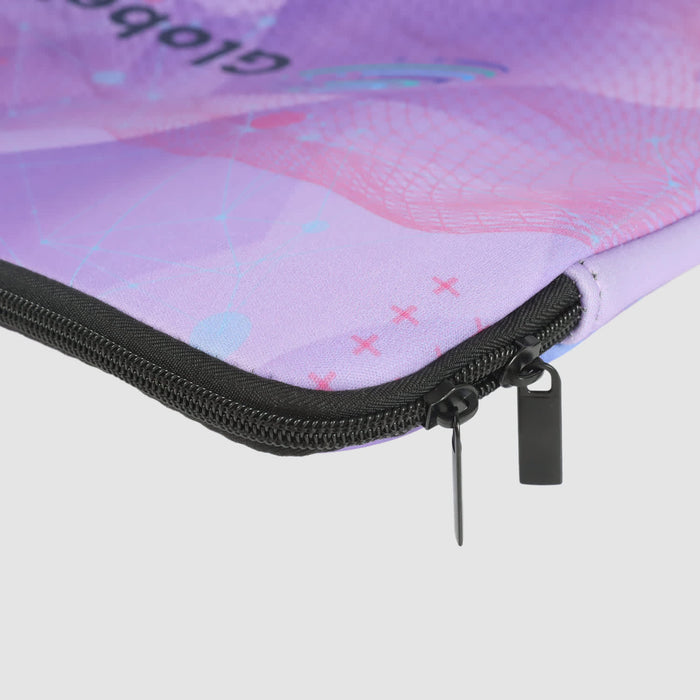 Full Colour Laptop Sleeve - Large - A large laptop sleeve in shades of purple with a stylish pattern and a black zip. It features a logo.