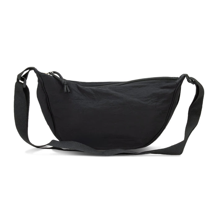 Selene Moon Bag - A black crossbody bag with a curved shape, featuring a zip closure and adjustable strap. It has a simple design with a logo.