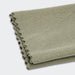 Frontier Rapid Dry Towel - A folded grey cooling towel featuring a textured fabric, suitable for outdoor activities. The towel has a branded logo.