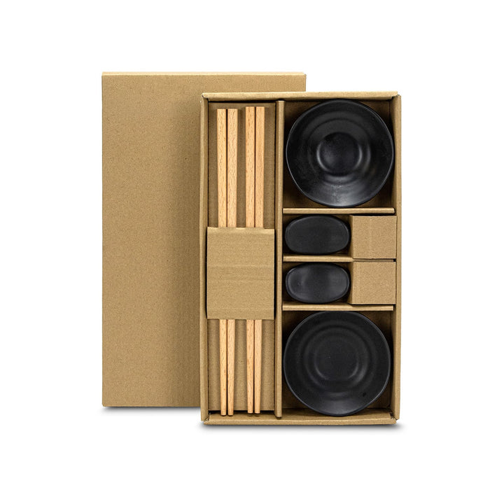 Keepsake Sushi Set - A keepsake sushi set featuring wooden chopsticks, black ceramic bowls, and soy sauce dishes in a cardboard box.