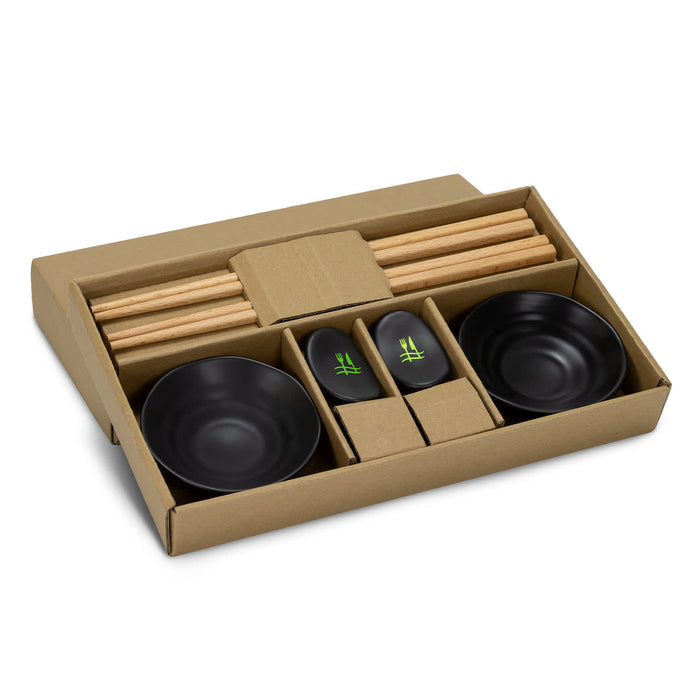 Keepsake Sushi Set - A sushi set featuring black bowls, bamboo chopsticks, and accompanying sauce dishes, presented in a cardboard box.