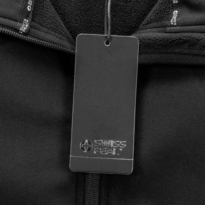 Swiss Peak Urban Unisex Softshell Jacket - A black softshell jacket with a branded tag attached near the collar. The fabric appears soft and warm.