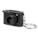 Candid Mini Camera - A small black camera keychain with a detailed lens and a keyring attachment. It has a logo on the top.
