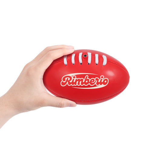 Mini Promotional Aussie Rules Ball - A red mini Australian Rules ball being held in a hand, featuring a logo on its surface.