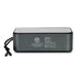 Swiss Peak 10W Bass Speaker - A grey Bluetooth speaker with a mesh top and a side strap, featuring branding and various technical labels on the back.