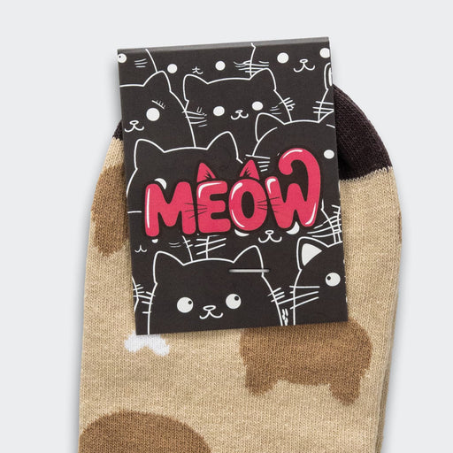Pixel Knitted Ankle Socks - Pixel knitted ankle socks in beige with a playful cat design, featuring a black and white card with a cat theme and logo.