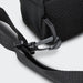 Callum Crossbody Bag - A black crossbody bag featuring a mesh panel and a secure clip on the strap. It has a simple, functional design.