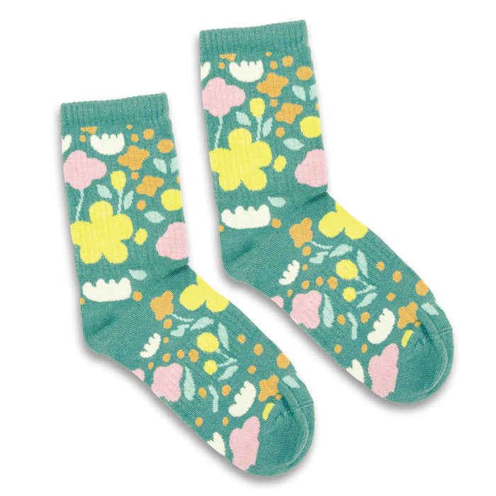 Jolly Knitted Bamboo Kids Socks - A pair of teal socks featuring a floral design in pink, yellow, and white, with a logo on one sock.